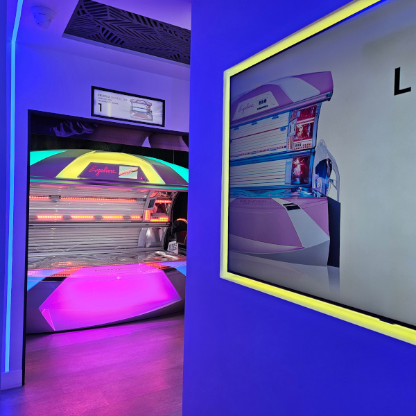 Contemporary interior of Q-TAN luxury tanning salon with professional audio installation
