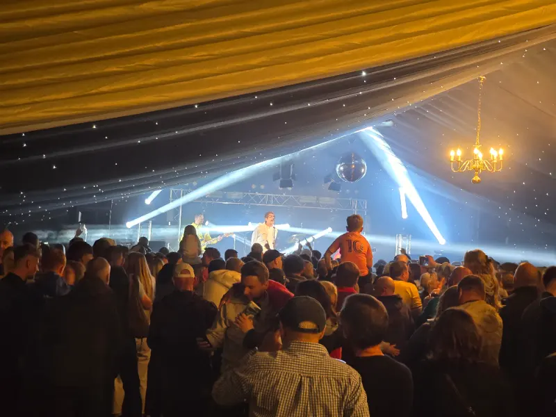 Oasis tribute act Definitely Mightbe performing to the crowd at Wetherby Beer Festival 2025